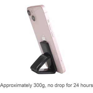 A pink smartphone secured on a black sticky nano rubber pad, angled upright for support.