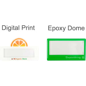 Two custom reusable acrylic name badges: one in white with an orange design and one in green with a simple shape.
