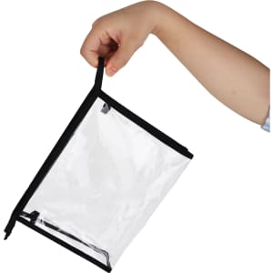 A PVC cosmetic bag with a transparent body and black trim, being held by a hand.