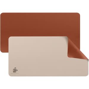 A PU leather desk mat featuring a brown and beige reversible design with a logo on one side.