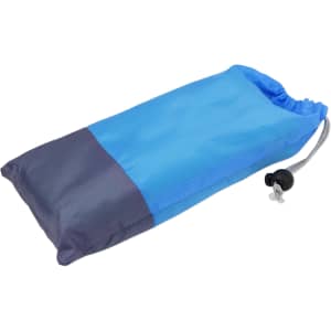 A blue and navy pouch containing a large picnic blanket, with a drawstring closure and a toggle.