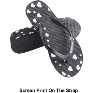 Classic black thongs featuring a heart print on the strap and a textured sole. Includes a logo on the side.