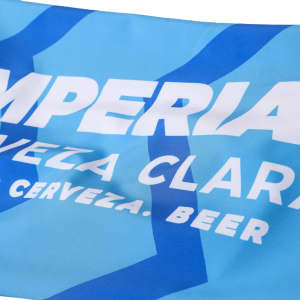 A blue flag featuring white text and a logo, displaying a beverage brand.