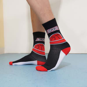Crew sport socks in black and red with a basketball-themed design, featuring branding and a contrasting white heel and toe.