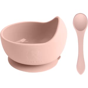 A pink silicone kids suction bowl with a matching spoon and a logo. The bowl features a built-in suction base.