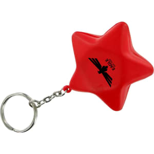 A red star-shaped stress reliever attached to a metal keyring, featuring a logo on its surface.
