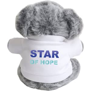 A grey koala plush toy wearing a white shirt with colourful text and a logo on the back.