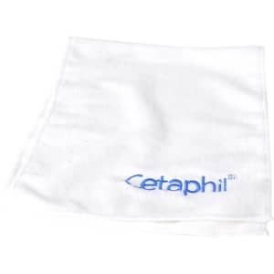 A white travel towel featuring a blue logo, folded neatly on a white background.