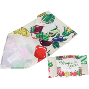 A reusable food wrap featuring a vibrant design of various fruits and vegetables, with a logo on one side.