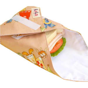 A reusable food wrap featuring a colourful design with animals, holding a sandwich with lettuce and tomato.