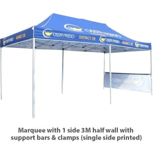 A large blue marquee featuring a half wall on one side, supported by sturdy bars and clamps, with a logo.
