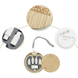 A bamboo circular kit containing various charging cables and connectors, featuring a smooth, natural finish.