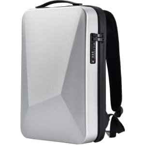 A silver expandable hardshell backpack with a sleek design and a combination lock on the side. It has a black strap.
