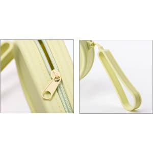 A round silicone storage bag in light green with a zipper closure and a loop handle. Features a logo.