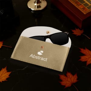A gold PU leather glasses pouch with a white interior, holding a pair of black sunglasses. Features a logo.