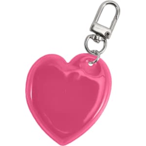 A heart-shaped reflective keychain in vibrant pink with a metal clip attachment.