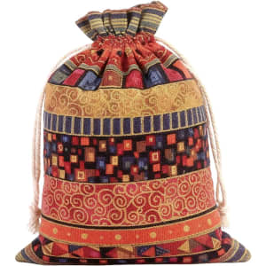 A colourful linen burlap drawstring bag featuring a mix of patterned stripes in red, yellow, blue, and orange.