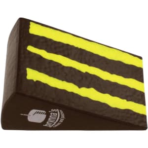 A brown and yellow chocolate cake shape stress reliever with a textured surface and a logo.
