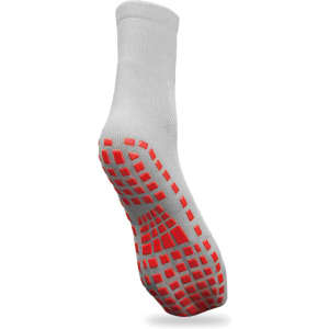 A pair of grey socks with a red grip pattern on the sole and a logo on the side.