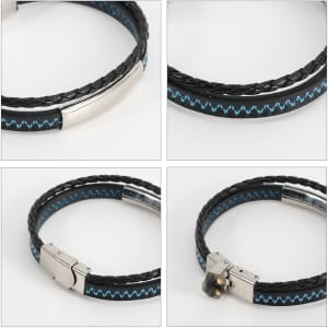 A double-layer leather bracelet featuring black and blue woven detailing with a metallic clasp and branding.