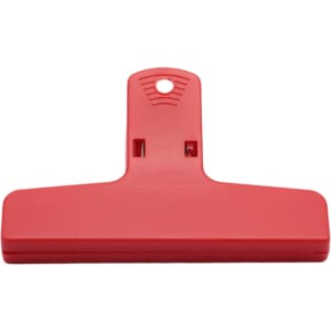 A red plastic clip with a hole for hanging and a flat grip surface. It features a logo on the front.