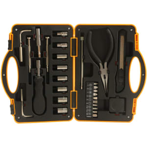 A truck-shaped toolkit in black and orange, featuring various tools including pliers and sockets, in a compact case.