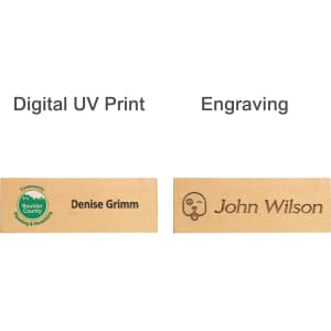 Wooden name badges featuring a green logo, one with digital UV print and another with engraving. Finished in natural wood.
