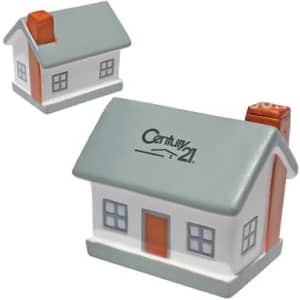 A house-shaped stress reliever in grey, white, and orange, featuring a chimney and a logo on the front.