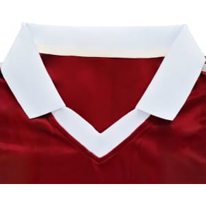 A red sports jersey with a white collar and a V-neck design, featuring a logo.