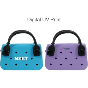 A mini handbag in blue and purple with perforated designs and a black handle. Features a logo on the blue bag.