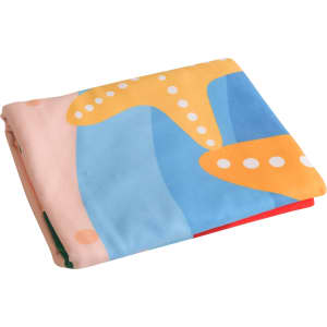 A folded microfibre beach towel featuring a colourful abstract design in blue, yellow, and pink, with a logo.