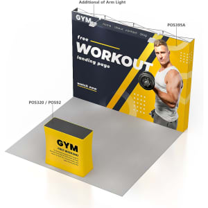 A large pop-up display wall in yellow and black, featuring a fitness model, with a counter in front.