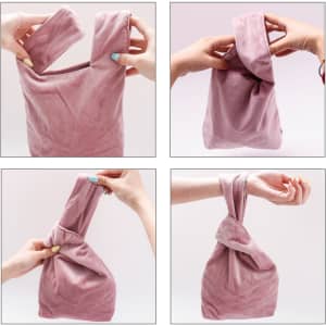 A pink Velvet Knot Wrist Bag is being manipulated into different positions, showcasing its flexible design.