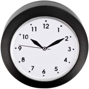 A round stress reliever in the shape of a clock, featuring a black outer casing and a white face with black numbers.