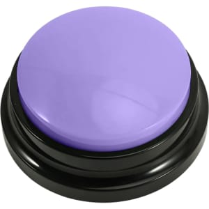 A purple voice recording button sits on a black base, featuring a smooth, glossy surface.