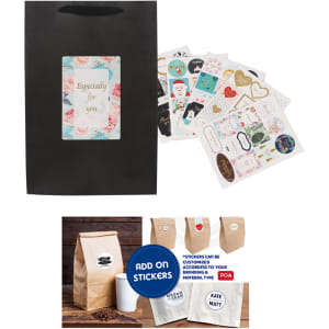 A small vertical black paper bag with a rope handle, accompanied by various decorative stickers.
