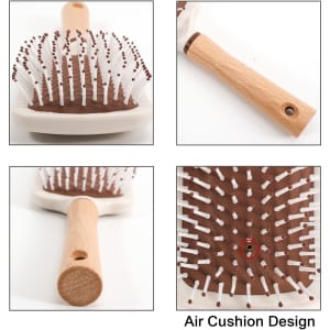 A paddle brush featuring a brown textured base, white bristles, and a wooden handle with an air cushion design.