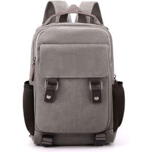 A grey canvas sling backpack with adjustable straps, side mesh pockets, and a front pocket. It features branding.