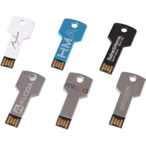 A collection of six key-shaped flash drives in silver, blue, black, and grey, featuring various brands.