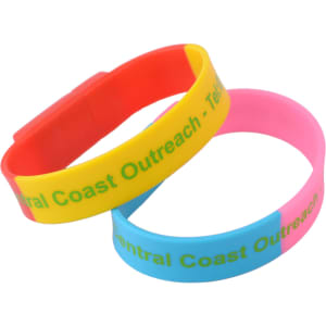 A colourful set of sectional wristband flash drives in red, yellow, pink, and blue, featuring logos.