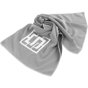 A grey cooling towel with a textured pattern and a logo in the centre.