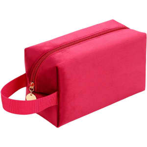 A pink flannel cosmetic bag with a zip closure and a handle, featuring a subtle logo.