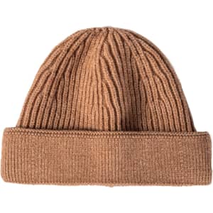 A round beanie in a warm brown colour, featuring ribbed texture and a rolled hem. It has a logo present.