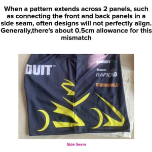 A close-up of a black and yellow garment featuring panel designs that may not perfectly align at the side seam.