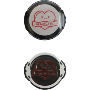 A custom self-inking stamp featuring a black design with a heart logo in red and white. It has a circular shape.