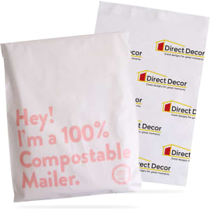 A large white biodegradable mailer bag with a logo and text about compostability.