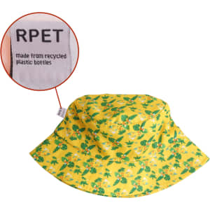 A yellow RPET bucket hat with a floral pattern and a label indicating it's made from recycled plastic bottles.