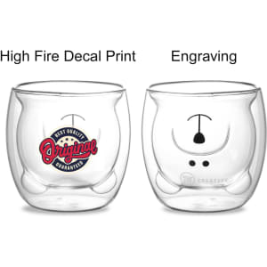 A double wall glass with a bear design, featuring a red and blue decal on one side and a simple engraving on the other.
