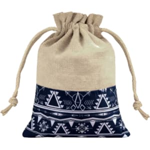 A cotton linen drawstring bag featuring a navy and white patchwork design with tribal patterns and a jute top.