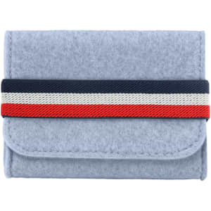 A grey felt essential oils travel organiser with a striped elastic band in navy, red, and white.